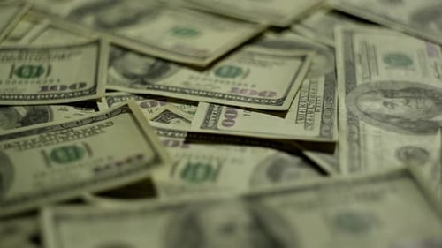 Background Video in Which the Camera Moves Sideways Over the Money