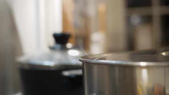 Steam lifts up over pots in kitchen, cooking time, close up, Food Stock ...