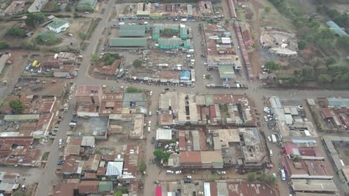 Aerial shot of buildings and huts in the African village of Loitokitok, Kenya
