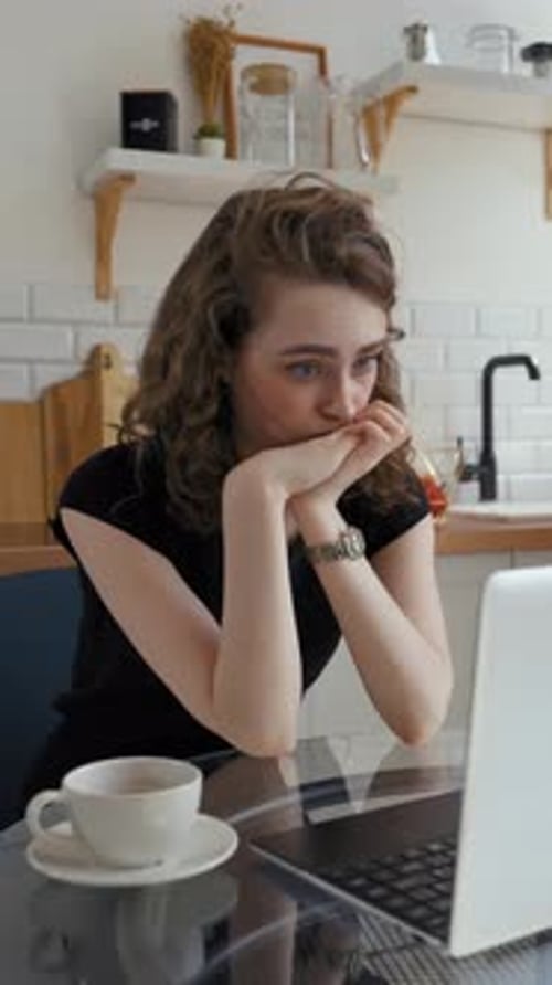 Vertical of Tired Woman Listens to Boring Online Lecture Closing Laptop