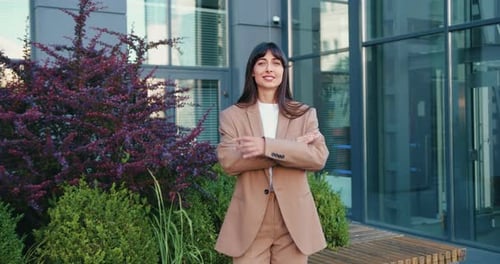 Confident Chic Businesswoman Looking at Camera Standing in City Street in Elegant Jacket Close Up