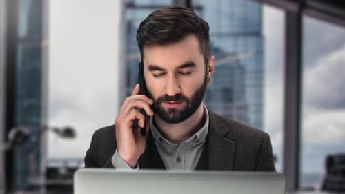 Fashion Business Man Talking Smartphone Discuss Deal Use Laptop Working at Skyscraper Office Window