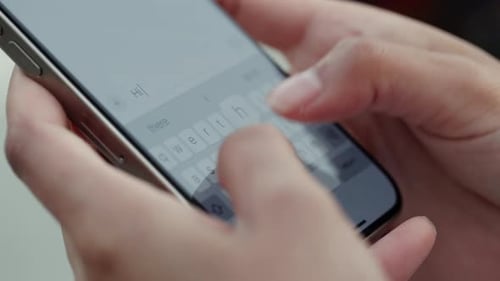 Crop View of Woman Hands Write Message to Boyfriend Via Smartphone Outdoor