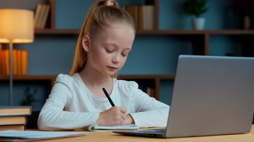 Caucasian Concentrated Little Child Pupil Student School Girl Daughter Kid Writing Notes Elearning