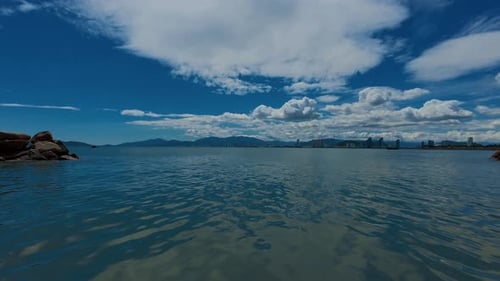Timelapse of the Sea or Ocean and Clouds in the Sky Blue Sky and Beautiful Aquamarine Water a