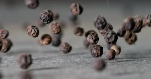 Peppercorns or black pepper spice. Super Macro Close Up. Shot on super slow motion camera 1000 fps.