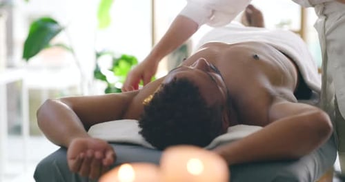 Man Receiving Acupuncture Treatment in Bright Room