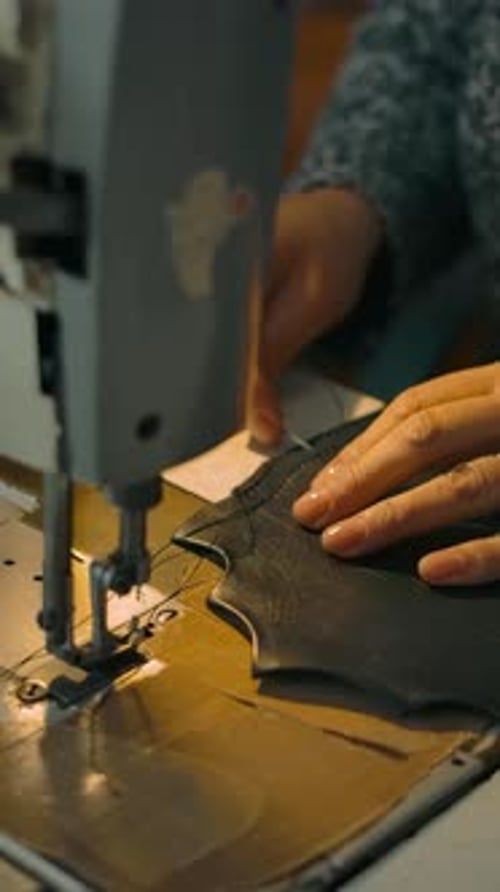 Vertical of Unrecognizable Woman Handles Leather for New Bag on Factory