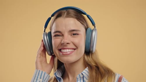Happy Woman Listening to Music with Headphones