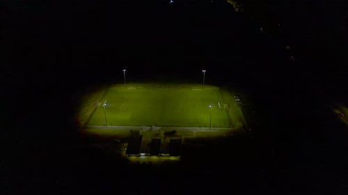 Night Soccer Game Under Bright Field Lights