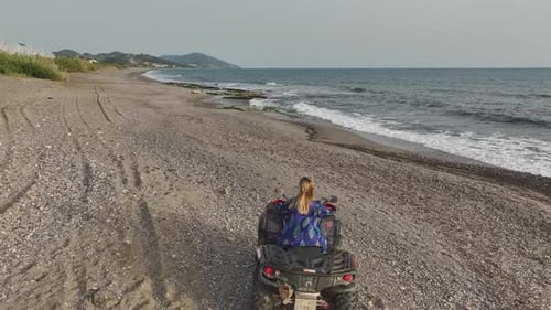 Coastal ATV Ride Aerial of Girl's Adventure on Mediterranean Shore