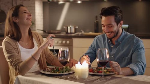 Couple Enjoying Romantic Candlelit Dinner at Home