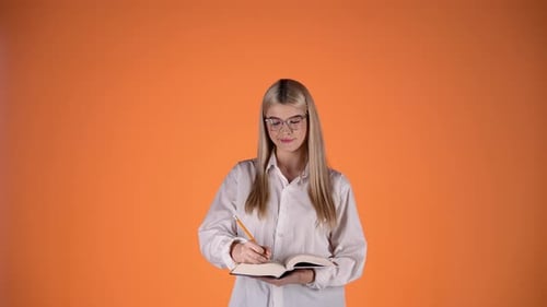 Attractive Blonde Woman Thought About Question And Found Answer, Writing Notes On Paper Notebook, St