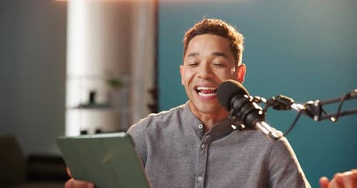 Influencer, microphone and content creator with man and tablet for live streaming