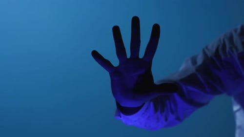 Hand Scanning Fingerprints on a Futuristic Screen