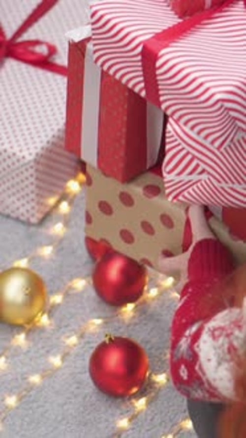 Festive Christmas Gifts Stacked Under Decorated Tree