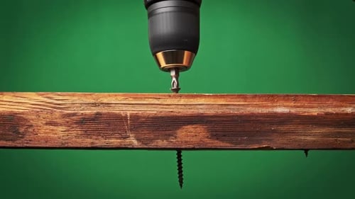 Screw Being Drilled Into Wood Plank