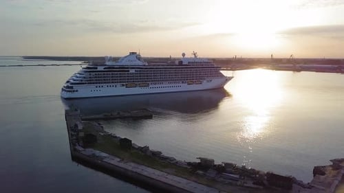 Aerial view of large white cruise liner Seven Seas Splendor arriving at the port of Liepaja (Latvia)