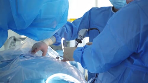 Surgeons Perform Laparoscopic Surgery in Operating Room