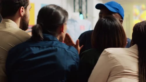 Diverse Team in Cheerful Workplace Huddle