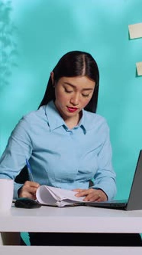 Secretary Completing Paperwork