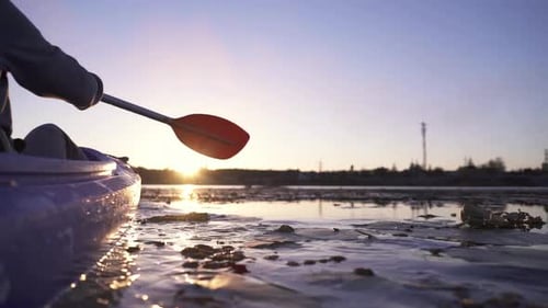 Kayak Paddling on Calm Lake at Sunrise