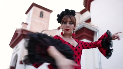 Woman Dances Flamenco in Traditional Dress Outdoors