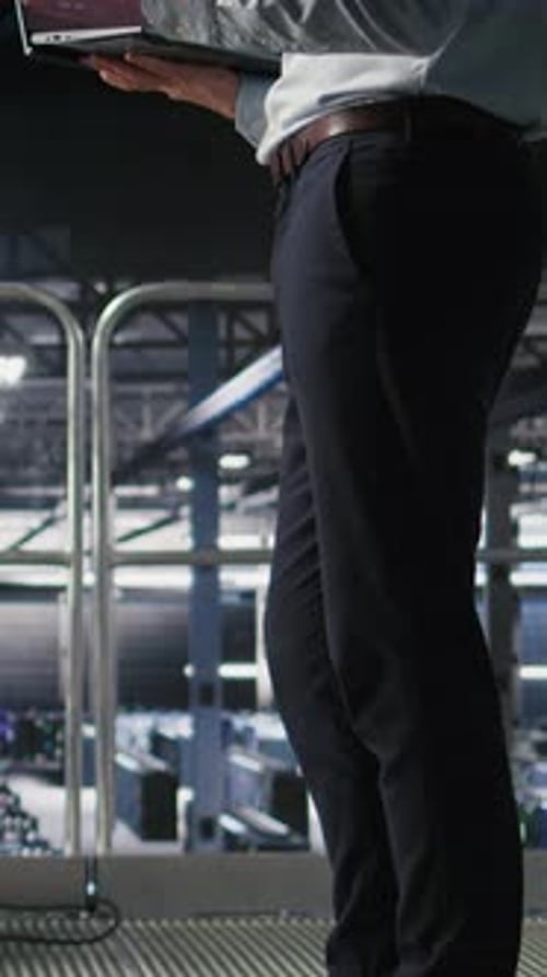 Vertical Video Annoyed Engineer in Data Center Reacting to Critical Error Message on Laptop