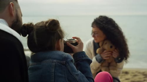 Family Playing Photo Camera on Sea Beach. Parents Child Photographing on Ocean