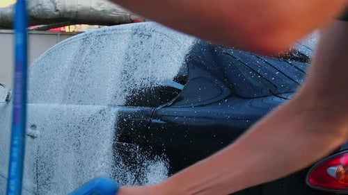 Washing Luxury Black Car on Touchless Car Wash Cleaning the Details of Car Washing Sedan Car with