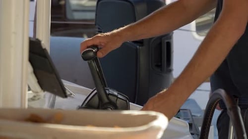 Operating Boat Controls on a Sunny Day