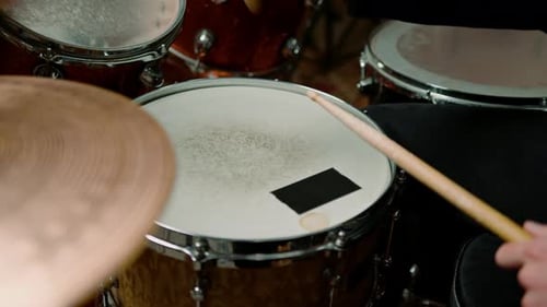 drummer plays a drum kit in a recording studio at a professional musician rehearsal recording a song
