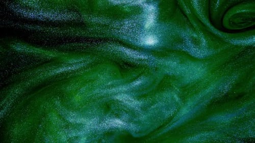 Beautiful Blend of Blue and Green Glitter Flow on a Shimmering Abstract Background