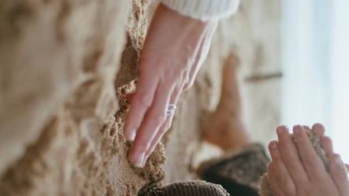 Closeup Boy Playing Sand on Ocean Shore Child Hands Building Castle Vertical