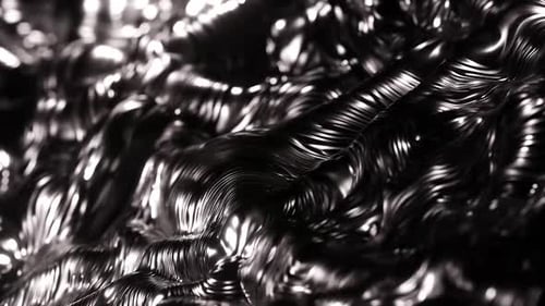 Dynamic metallic liquid surface ripples and catches the light
