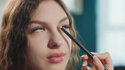 Close Perspective Of Woman Applying Makeup With Precision And Style Detailed View Of Beauty Model