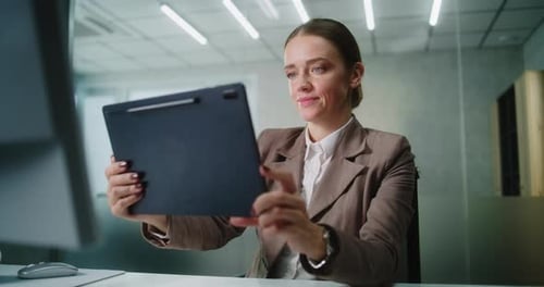 Woman Having a Video Call in Modern Office