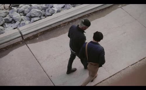 Men Walking and Talking on Sidewalk 3034 Years