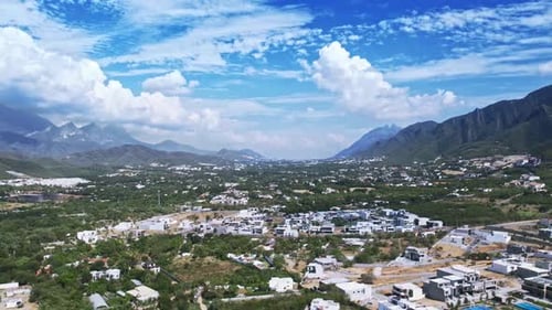 Scenic Aerial View of Lush Green Valley and Mountain Range