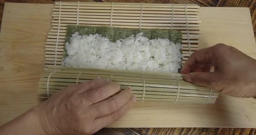 Making Sushi Roll at Home with Bamboo Mat