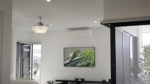 Contemporary open plan living room, dining room, and kitchen. White tiles, white lounge, white house