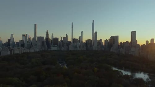 Central Park Glows with Vibrant Fall Colors As the Sun Sets Behind the Midtown Manhattan Skyline