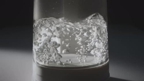 Water Coming to a Boil in Glass Kettle