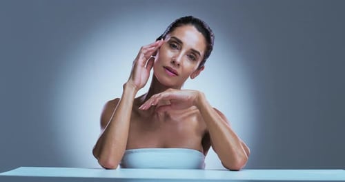Woman Posing with Hands Near Face in Studio