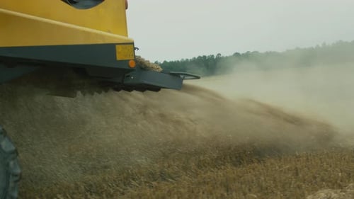 Close-up shot of Working Combine Harvester.