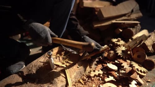 Hand crafting man working on raw wood material with gloves close up