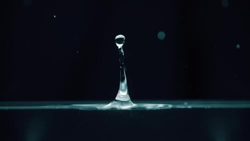 Water Drop Impacting Liquid Surface in Slow Motion