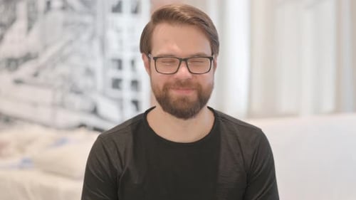 Man With Beard and Glasses Smiling