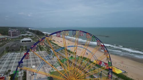 A Colourful Ferris Wheel Spinning Slowly in an Amusement Park at Night with Stars in the Background