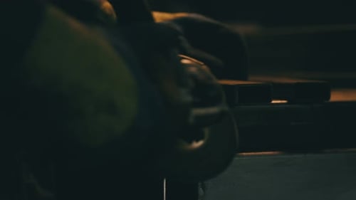 Worker grinding iron